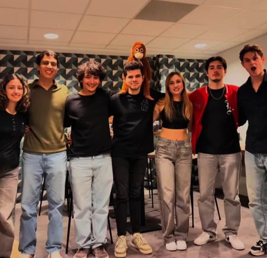 The ESN activity team posing together with an orangutan plush mascot